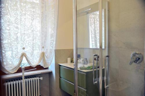 a bathroom with a shower and a sink at Casa Marina in San Pellegrino Terme