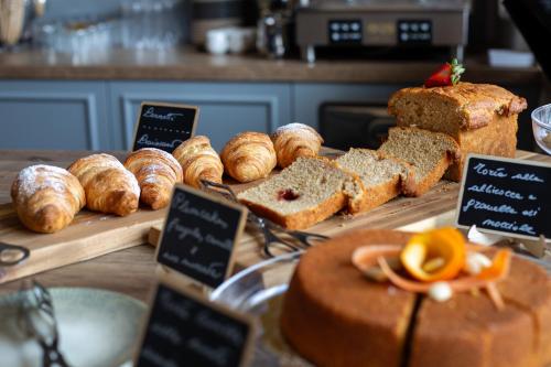 a display of bread and pastries on a table at Trulli Damari in Locorotondo