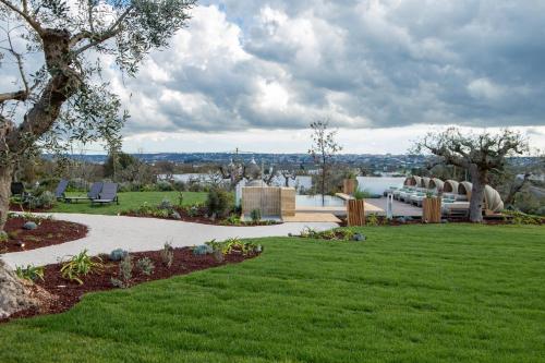 a view of a park with green grass at Trulli Damari in Locorotondo