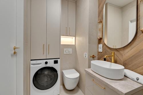 Ένα μπάνιο στο Portovo Riverside Suites by Lion Apartments Gdańsk