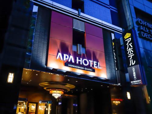 a sign for a hotel on the side of a building at APA Hotel Asakusabashi Ekikita in Tokyo