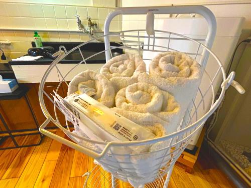 a basket full of donuts sitting on the floor at MM Stay Takamatsu Kawaramachi in Takamatsu