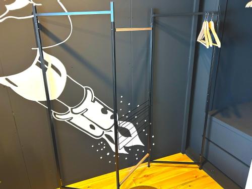 a glass door with a dog decal on it at MM Stay Takamatsu Kawaramachi in Takamatsu