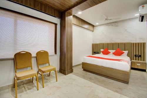 Katil atau katil-katil dalam bilik di Capital O V Hotel