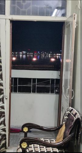 a room with a window with a snake on the floor at Lakeview Flat-Dargah,Pushkar 10mins away in Ajmer