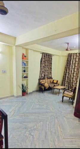a living room with two chairs and a couch at Lakeview Flat-Dargah,Pushkar 10mins away in Ajmer