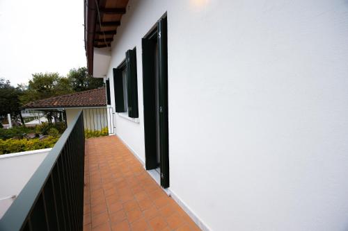 a hallway of a house with two open doors at Lunavi in Forte dei Marmi