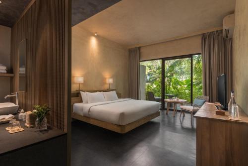Postel nebo postele na pokoji v ubytování Amorita Resort Bohol