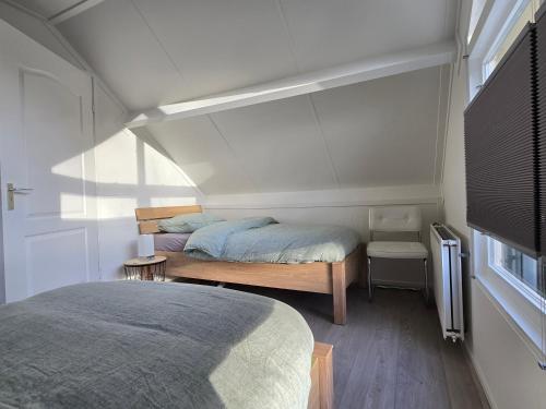 Postel nebo postele na pokoji v ubytování Vakantiewoning Bosvogel