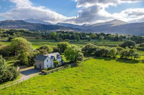 an aerial view of a house in a field at Perthi-Uchaf in Cwm-y-glo