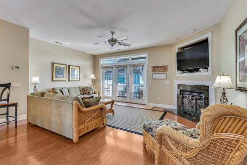 a living room with a couch and a fireplace at Jacks Beach House by Carolina Beach Realty in Carolina Beach