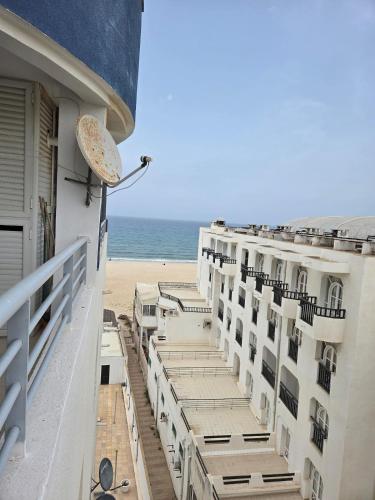 a view of the beach from the balcony of a hotel at Luxurious 2 bedroom apartment in Sousse