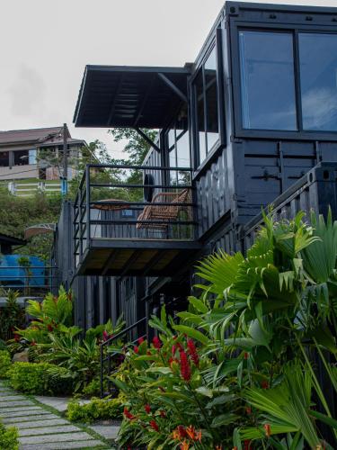 a house with two decks and some plants at Nomada Republic Hotel El valle in Valle de Anton