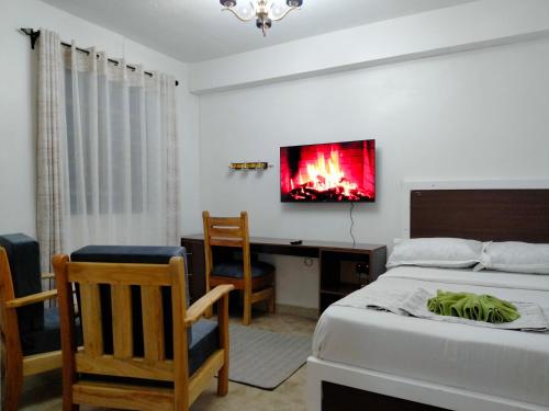 Postel nebo postele na pokoji v ubytování Nanyuki Cozy Haven