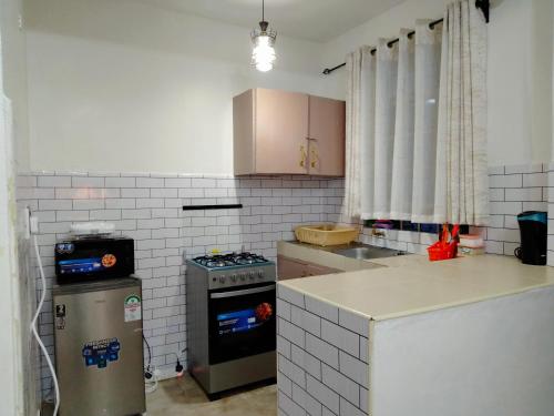 Kuchyň nebo kuchyňský kout v ubytování Nanyuki Cozy Haven