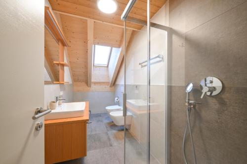Koupelna v ubytování Apartments Ferdigg