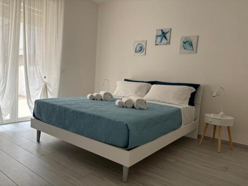 Postel nebo postele na pokoji v ubytování BluMare Ospiti