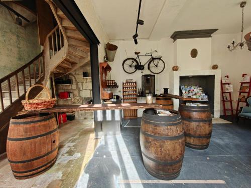 a room with barrels and a bike on the wall at Château de Vallagon in Montrichard