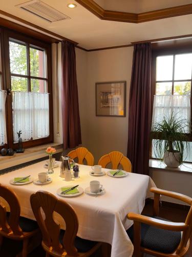 a dining room with a table and chairs at Landgasthof Zum Engel in Angelbachtal