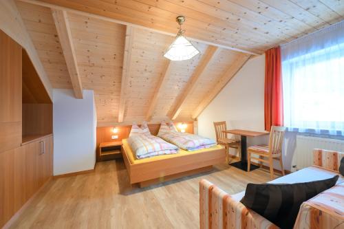 Postel nebo postele na pokoji v ubytování Apartments Ferdigg