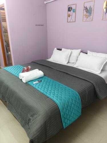 two beds sitting next to each other in a room at Rudhraksh Comfort Stay in Tiruvannāmalai