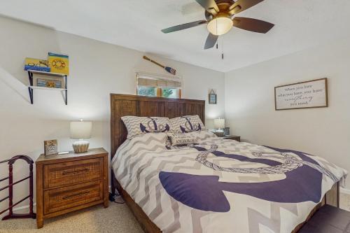 a bedroom with a bed and a ceiling fan at Stegs Retreat in Caryville