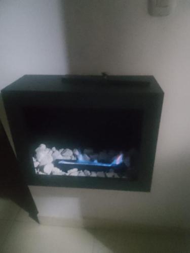 a black box with a blue object in a room at Cabañas hotel COLONIA SAN MIGUEL in Paipa