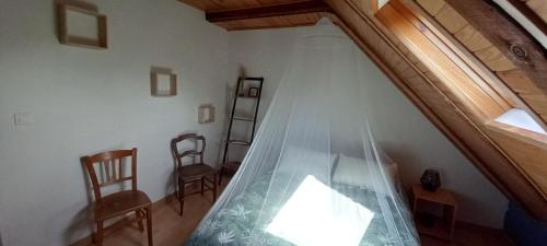 Katil atau katil-katil dalam bilik di chambres d'hôtes Imago