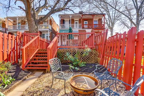 a garden with chairs and a fence with a house at 2 Mi to Dtwn Harrisburg Escape with Furnished Deck! in Harrisburg