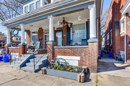 a brick house with a planter in front of it at 2 Mi to Dtwn Harrisburg Escape with Furnished Deck! in Harrisburg