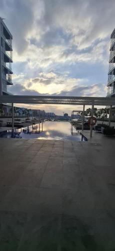 a bridge over a body of water near some buildings at almoaj ,juman 2 marina view, in Ḩayl Āl ‘Umayr