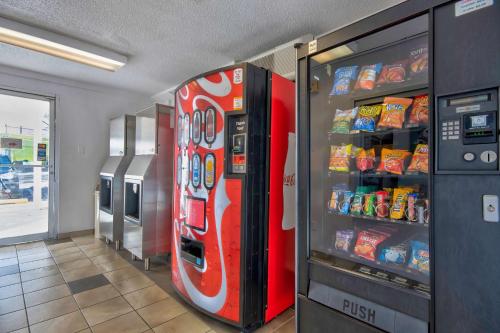 a coca cola vending machine in a store at Motel 6 Santa Fe in Santa Fe