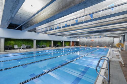 a large indoor swimming pool with a large pool at The Hotel & Athletic Club at Midtown in Chicago