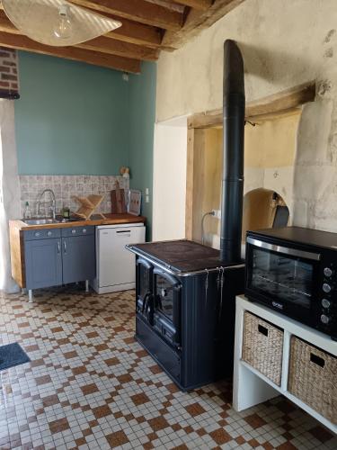 Kuchyň nebo kuchyňský kout v ubytování Gîte de l'oeillet