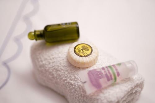 a bottle of wine sitting on top of a towel at P & K Design LTD Flats in Nea Moudania