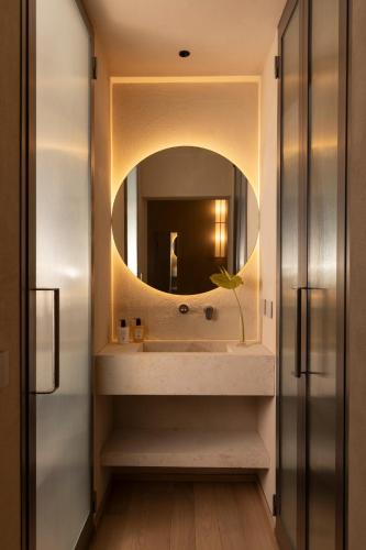 a bathroom with a sink and a mirror at Velvet Grey Boutique Hotel Roma in Rome