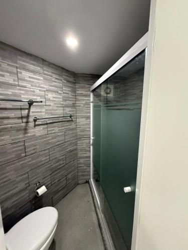 a bathroom with a toilet and a shower at Departamento nuevo con Vista al Mar! in Acapulco