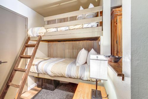 two bunk beds in a room with a ladder at Walk to Shops & Eats: Mammoth Lakes Condo w/ Pool in Mammoth Lakes