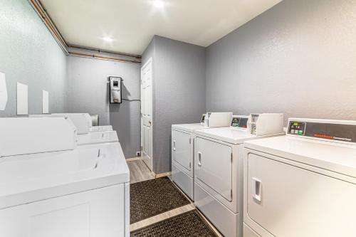 a laundry room with white washers and dryers at Walk to Shops & Eats: Mammoth Lakes Condo w/ Pool in Mammoth Lakes