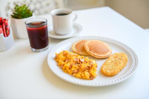 a plate of breakfast food with toast and pancakes at Hotel Uxulkah in Campeche