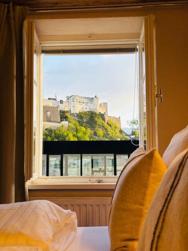 a window with a view of a castle at APT. STONE-LODGE in Salzburg