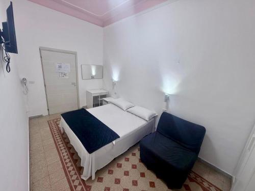 a bedroom with a bed and a chair in it at BeLLa Vista in Rome