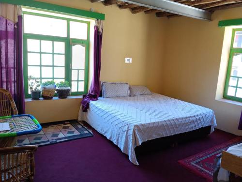 Postel nebo postele na pokoji v ubytování Khabrik Home Stay