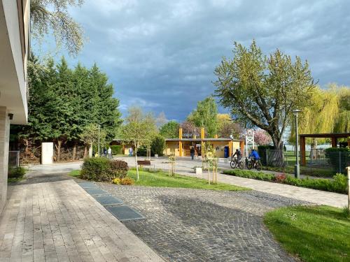 a brick road with a building in the background at Nekem Füred in Balatonfüred