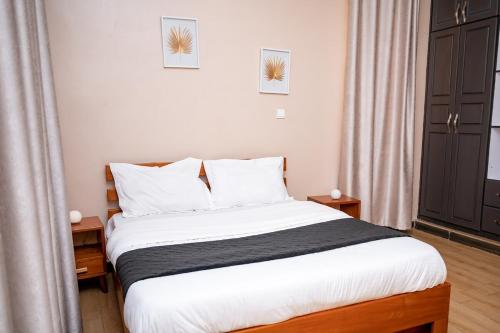 Ένα ή περισσότερα κρεβάτια σε δωμάτιο στο WanderHome 1BDR