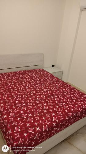 Ένα ή περισσότερα κρεβάτια σε δωμάτιο στο Il Risveglio delle Onde