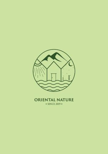a logo for a real estate agency with a house at Oriental Nature in Majdal Shams