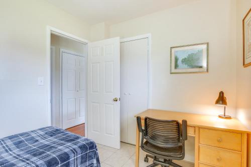 a bedroom with a desk and a bed and a chair at 7 Mi to Dtwn Dayton Home in Kettering with Yard in Dayton