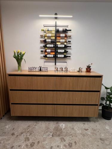 a counter with a bunch of wine bottles at Horský hotel Remata in Ráztočno