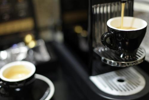 two cups of coffee are sitting on a counter at Hampton Inn & Suites by Hilton Miami Downtown/Brickell in Miami